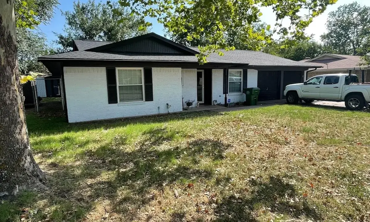 Professional roofing crew working on a residential roof in Bel Aire